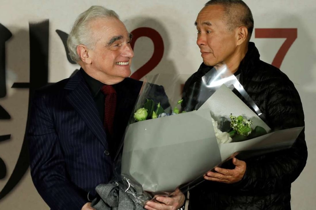 Director Martin Scorsese receives flowers from Taiwanese director Hou Hsiao-Hsien during the premiere of Silence in Taipei on January 19. Photo: Reuters
