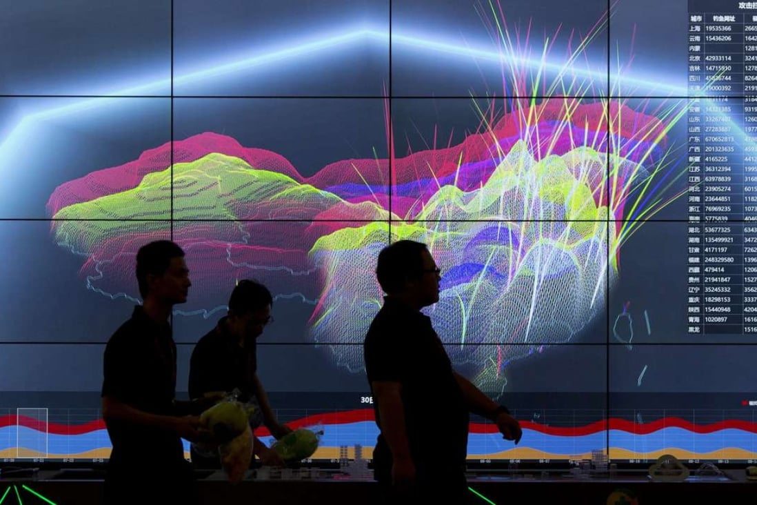 Attendees walk past a live visualisation of internet attacks across China during the 4th China Internet Security Conference in Beijing in August 2016. Photo: AP
