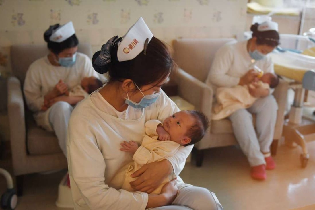 A nurse caring for a baby at a medical centre in Beijing. Photo: AFP