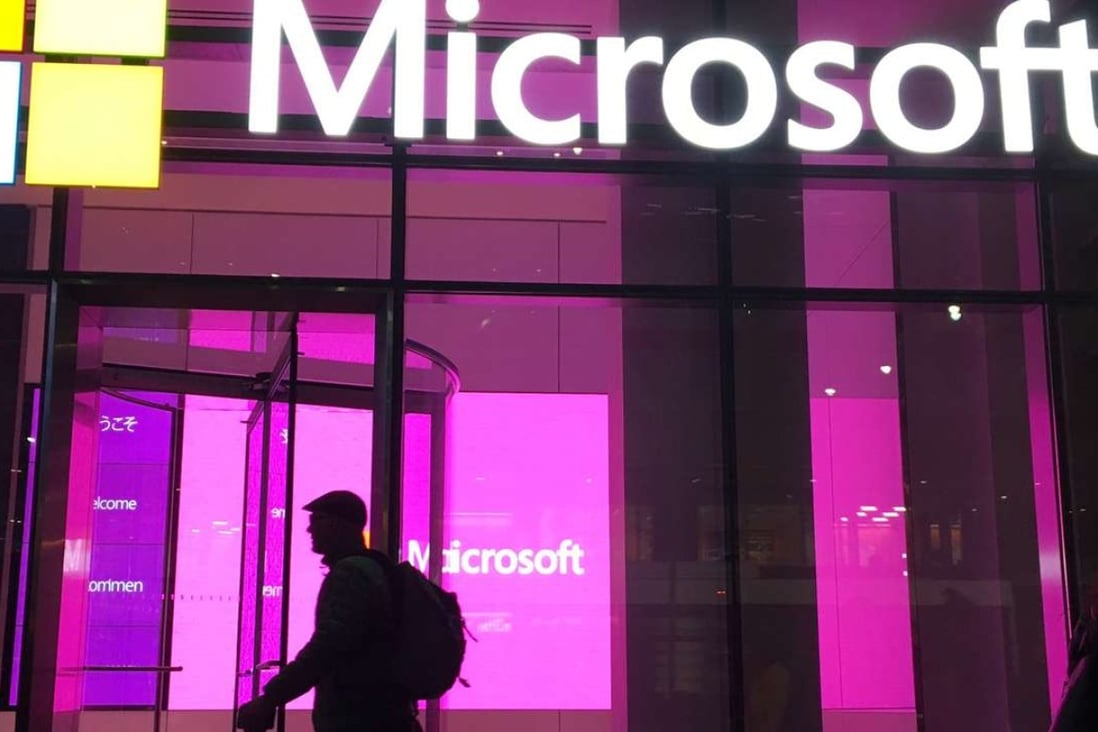 People walk near a Microsoft office in New York. Photo: AP