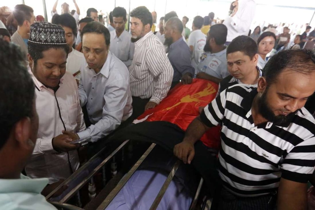 People pay respects to the late lawyer Ko Ni at the Muslim cemetery in Yangon. Photo: EPA