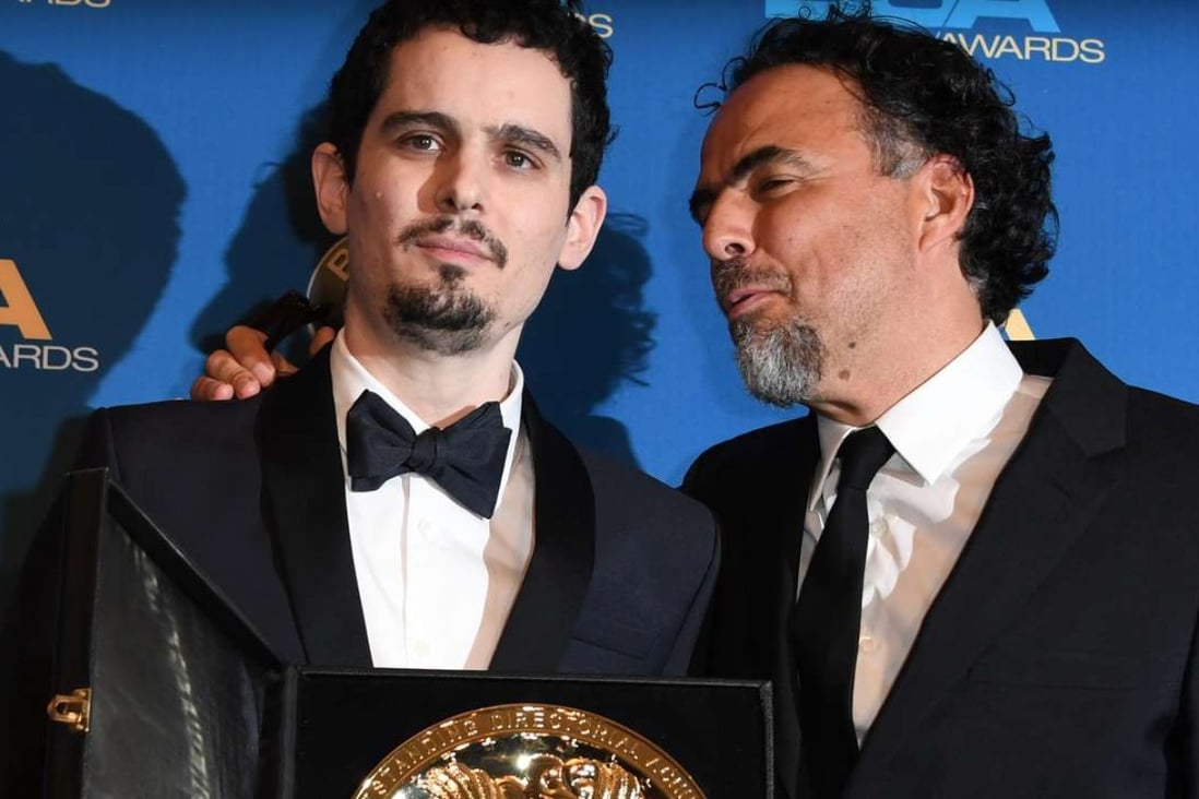 Damien Chazelle (left), winner of the Best Director in a Feature Film Award for La La Land, poses with last year's winner, director Alejandro Gonzalez Inarritu, at the 69th annual Directors’ Guild Awards on Saturday. Photo: AFP