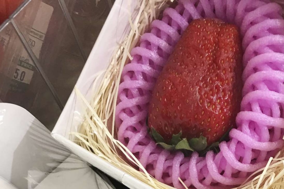 An individually packaged strawberry from Kotoka, Japan, on sale for HK$168 as a Valentine’s Day gift at City’super in Causeway Bay, Hong Kong. Photo : SCMP