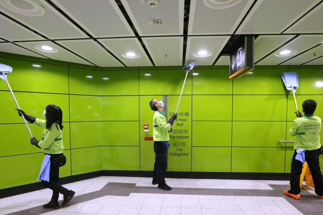 MTR staff cleaning inside the South Horizons MTR station. Photo: Dickson Lee