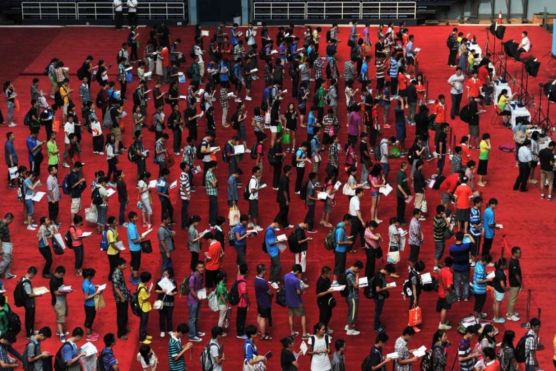 First year students queue for IDs during enrolment day at Tsinghua University in Beijing. Photo: Xinhua