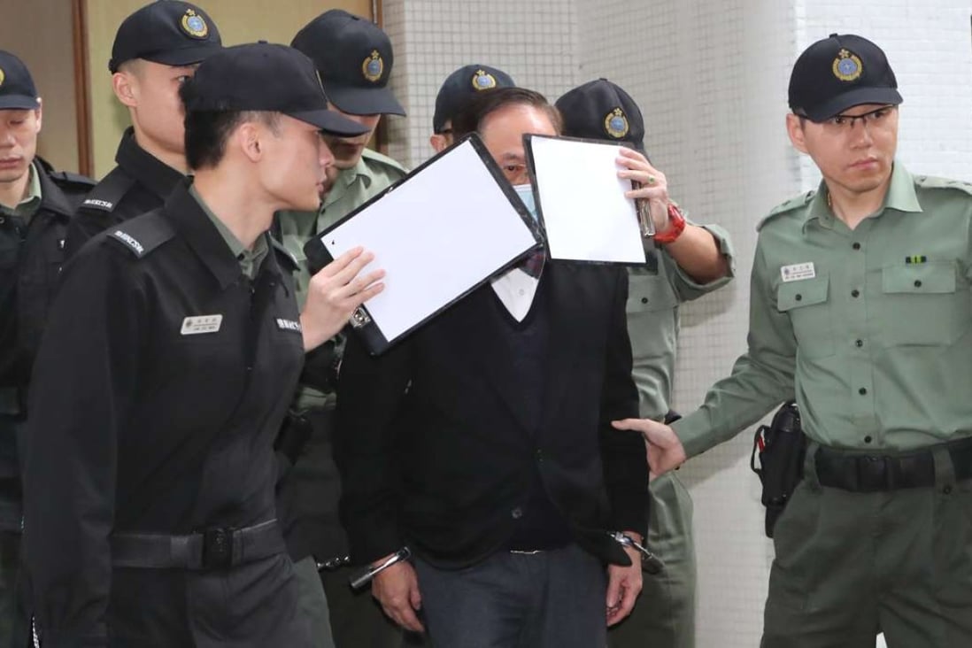 Former chief executive Donald Tsang Yam-kuen being escorted to a prison van by correctional officers. Photo: Edward Wong