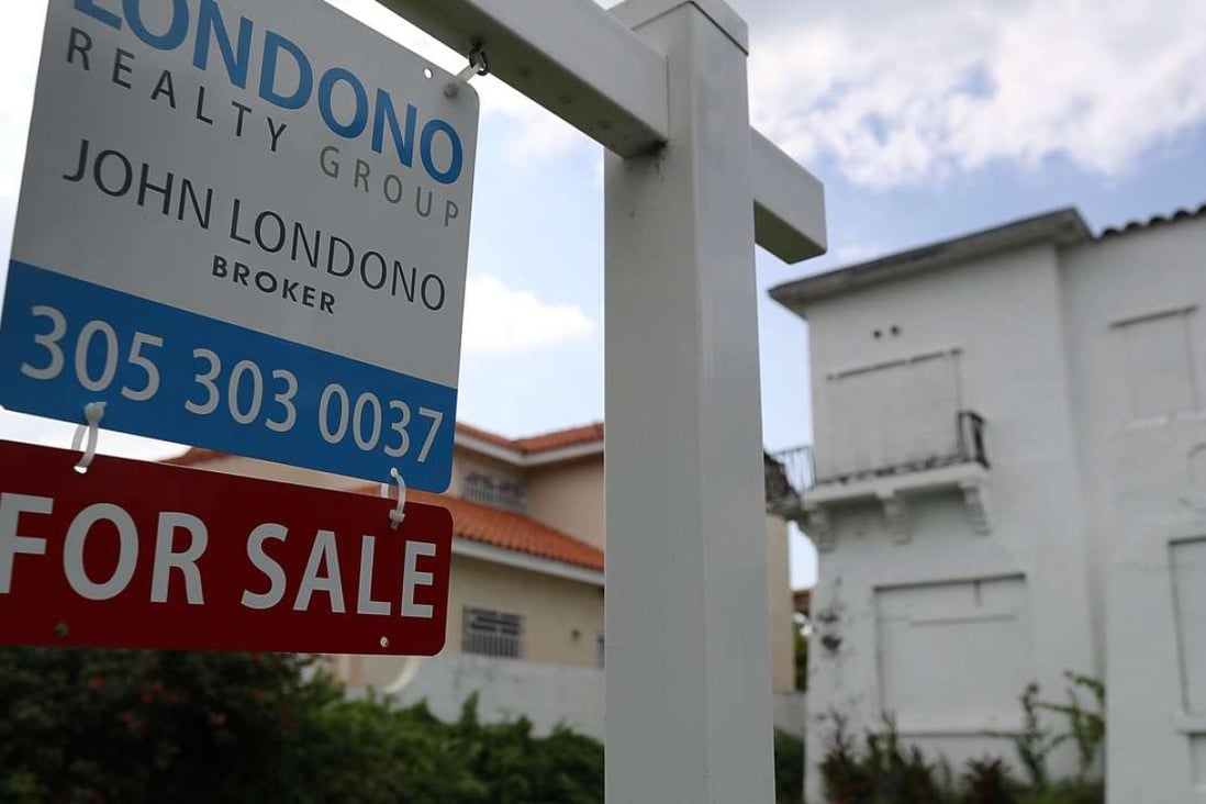 A for sale sign posted in front of a home in Miami, Florida. Photo: AFP