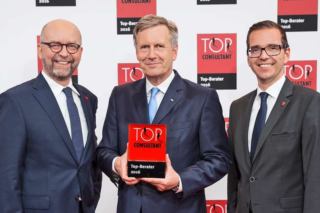 (From left): Christian Haart, chief operations officer; Christian Wulff, Top Consultant 2016 Award mentor; and Holger Korn, CEO