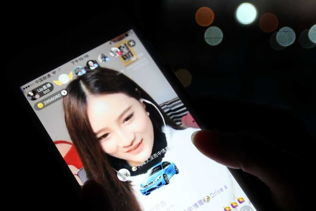 Hai Zhenzhen, who broadcasts live video of her daily routines, receives a digital sports car from one of he male fans. She can convert the value of the gifts into cash, sharing half of the proceeds with the platform that hosts her broadcast. The most popular hosts on UpLive can take in 100,000 yuan a month, the platform says. Photo:Simon Song