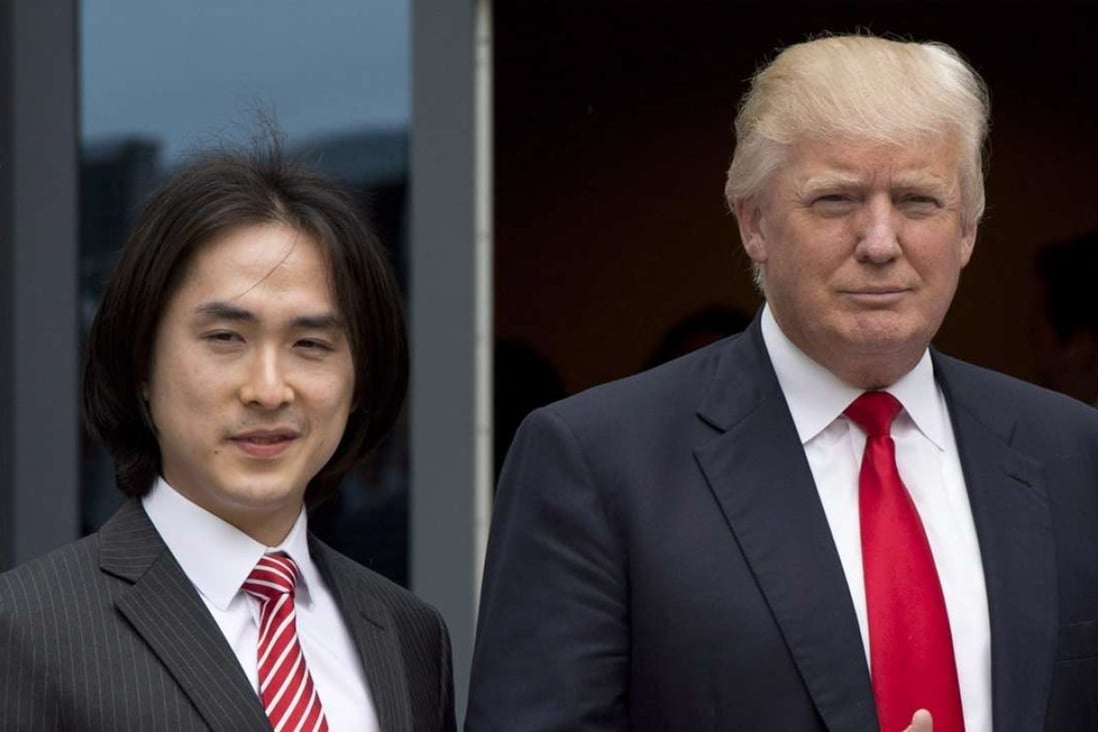 In this 2013 file photo, Donald Trump gives a thumbs-up as he poses with Tiah Joo Kim, left, CEO and president of Holborn Group, upon arrival to announce the building of Trump International Hotel and Tower Vancouver in downtown Vancouver, Canada. Photo: The Canadian Press via AP