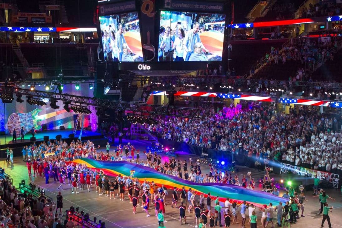 Competitors file in to Quicken Loans Arena in Cleveland, Ohio for the opening ceremony of the Gay Games 2014. Photo: Alamy