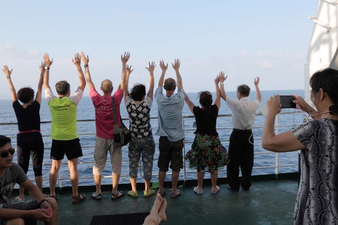 Chines tourists pictured on a cruise to the Paracel Islands last year. Photo by Liu Zhen