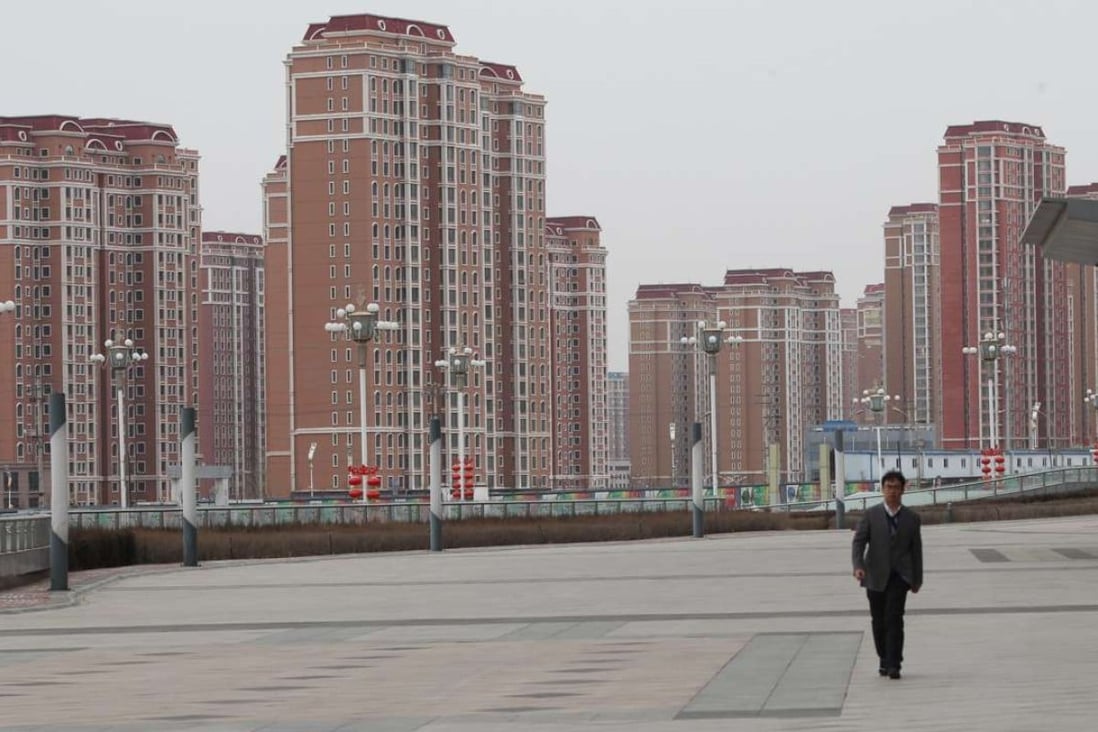 Residential buildings in which only few people actually living in Kangbashi district, Ordos city, Inner Mongolia, on Feb. 16, 2017. Kangbashi is a totally new district built on desert, the local administrations have been moved to this new district, large number of new style buildings were built and many however were suspended due to lack of continuous financial support. 16FEB17 SCMP/Simon Song