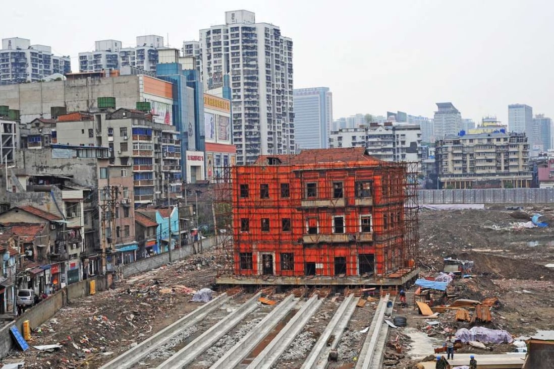 A historical building being moved to make way for new construction in Wuhan, Hubei Province, one of the second-tier cities that have been leading land sales this year. Photo: Reuters