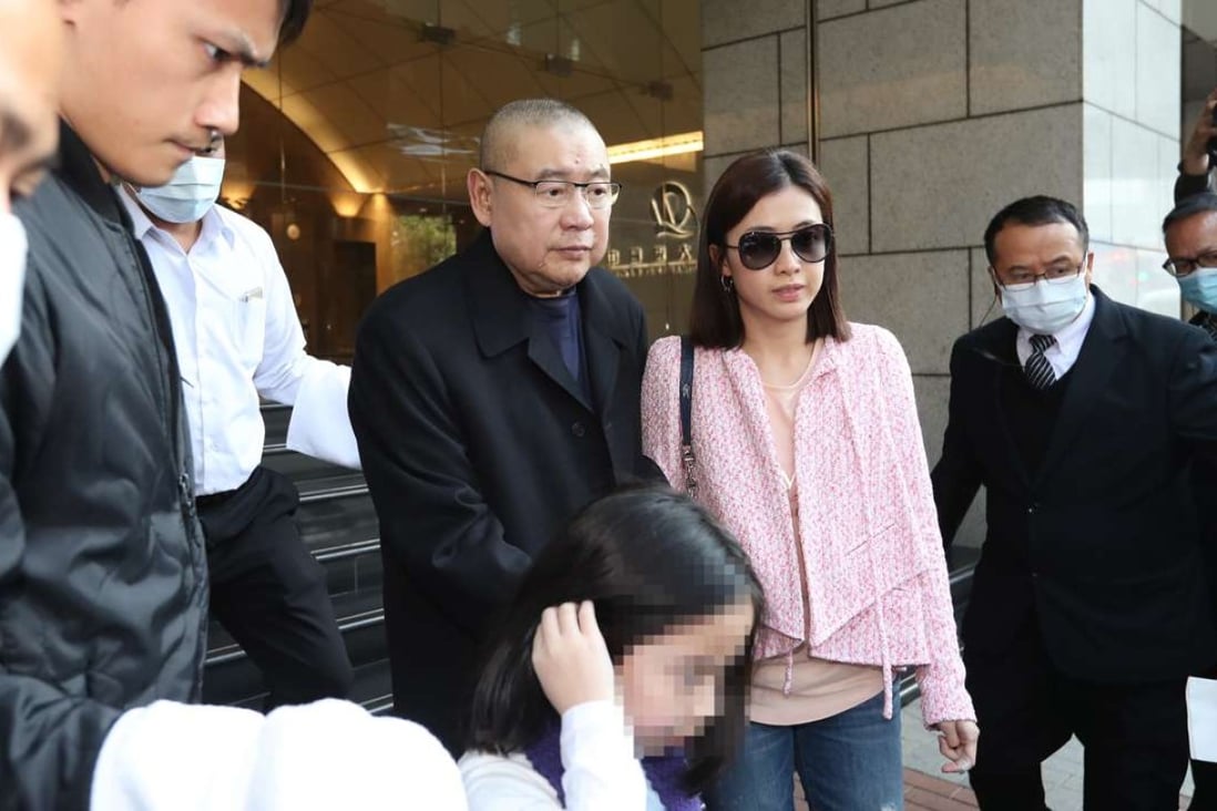 Former chairman of Chinese Estates Joseph Lau Luen-hung, accompanied by his wife Chan Hoi-wan and daughter, leave China Evergrande Centre in Wan Chai on March 2, 2017. Photo: Edward Wong