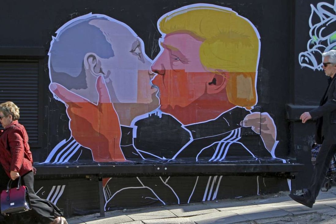 A mural on a restaurant wall in the Lithuanian capital, Vilnius, depicts US President Donald Trump and Russian President Vladimir Putin greeting each other with a kiss. Photo: AFP