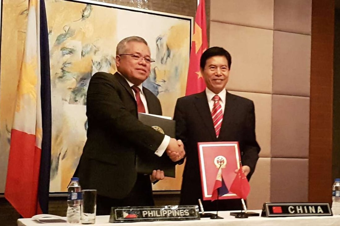 Philippine Trade Secretary Ramon Lopez shakes hands with China's Commerce Minister Zhong Shan in Manila last week. Photo: Reuters