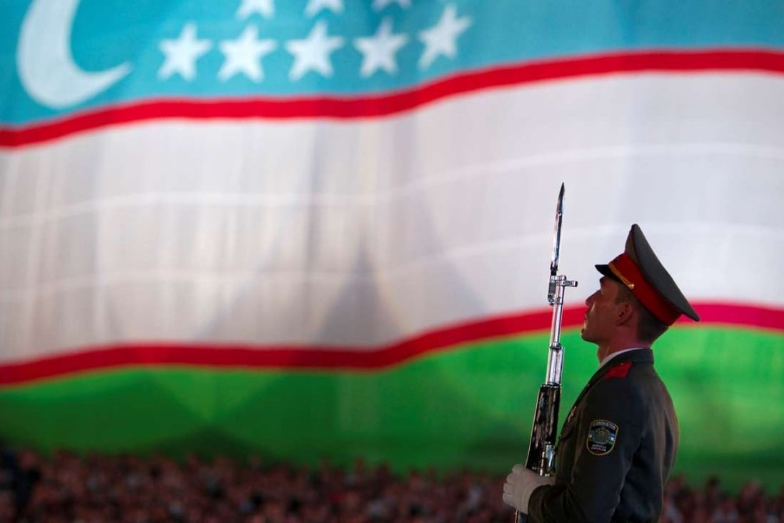 A soldier stands in front of the national flag during Independence Day celebrations in Tashkent, capital of Uzbekistan, in 2012. The former Soviet republic is fearful of simply being a conduit for Chinese goods under the belt and road initiative. Photo: Reuters