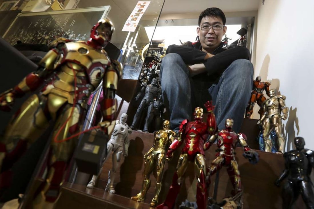Mars Tsoi shows off his extensive collection of toy figures at his home in Tsuen Wan. Photo: Nora Tam