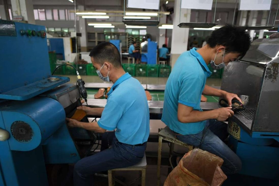A file picture of workers at a shoe factory in Guangdong province. Photo: AFP