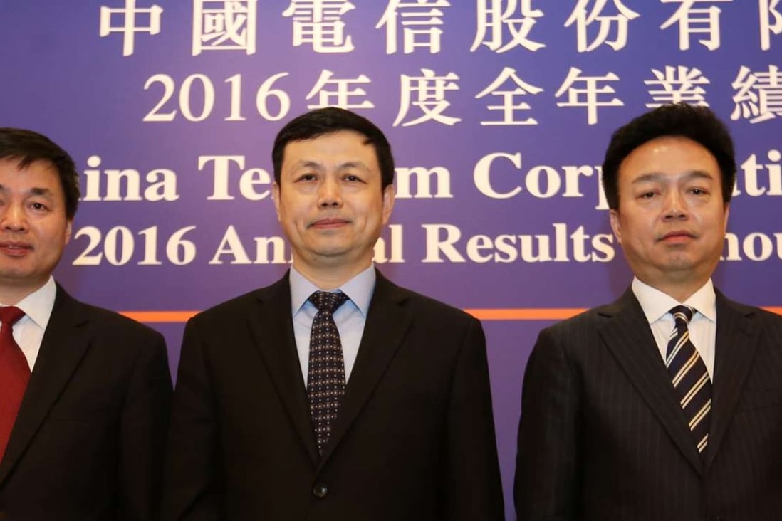 China Telecom executives at the results announcement in Hong Kong on Tuesday. From left, executive vice president Ke Ruiwen, chairman and CEO Yang Jie, and president and COO Yang Xiaowei. Photo: Xiaomei Chen