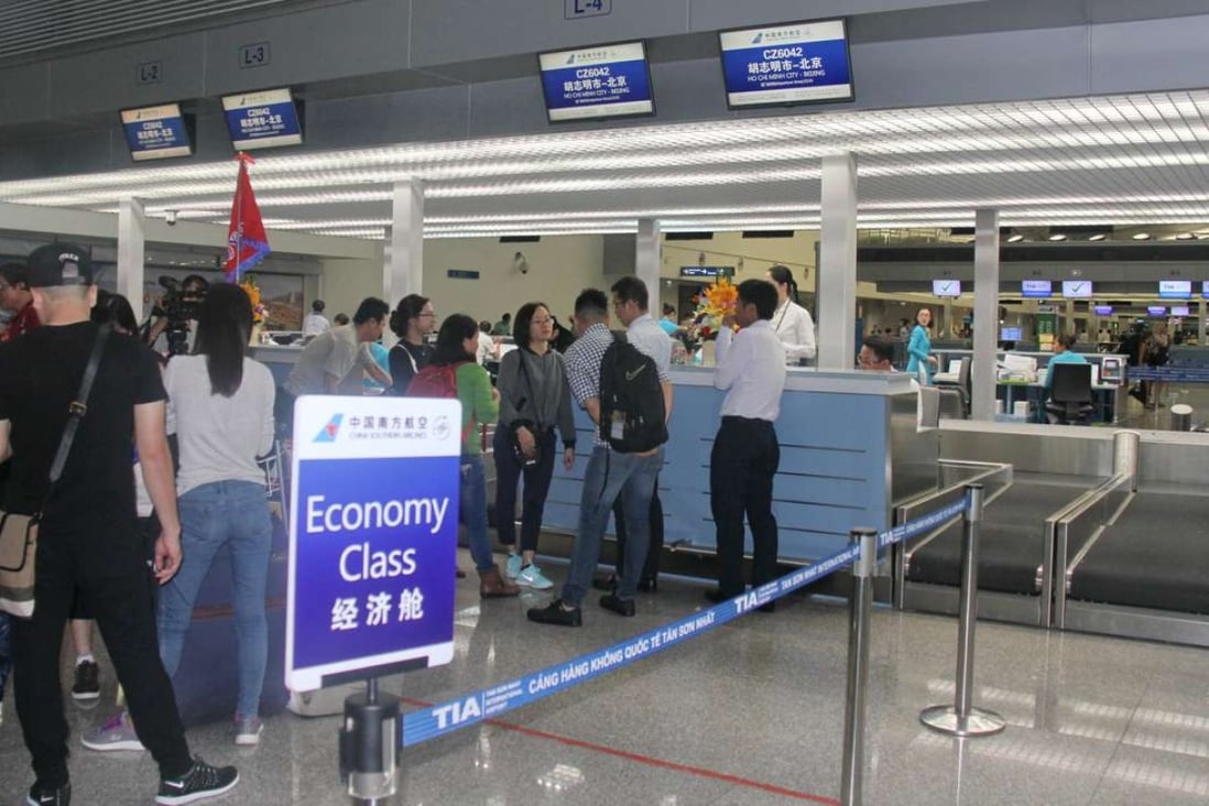 China airline passenger volume during the Lunar New Year holiday was up 15.1 per cent on year. Passengers check in for the debut flight of Southern Airlines from Ho Chi Minh City to Beijing on March 18, 2017. Photo: Xinhua