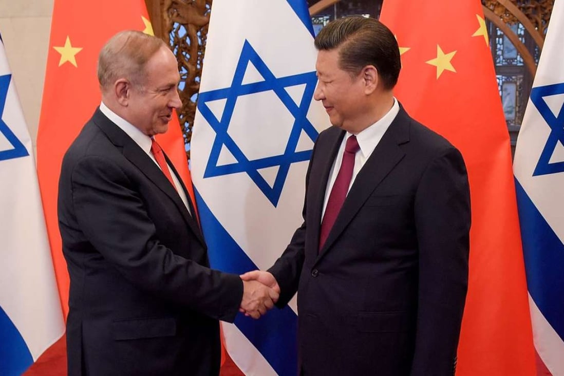 Chinese President Xi Jinping and Israeli Prime Minister Benjamin Netanyahu shake hands ahead of their talks at Diaoyutai State Guesthouse in Beijing on Tuesday. Photo: Reuters