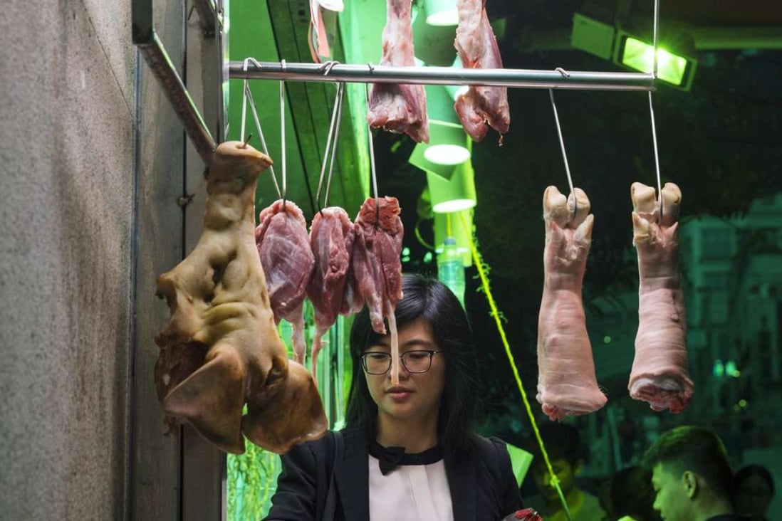 A woman buys meat from a butcher stall in Hong Kong, China. Hong Kong's Centre for Food Safety stated that imports of frozen and chilled meat as well as poultry from Brazil would be temporarily suspended with immediate effect as a precautionary measure due to recent reports of the sale and export of rotten meat by some of Brazil's largest meat producers. Photo: EPA