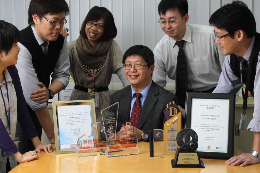 Jimmy Lau Fu-shing (sitting), CEO of Richform Holdings, has implemented many innovative family-friendly employee care policies for his office in Kwun Tong. Photo: Edward Wong