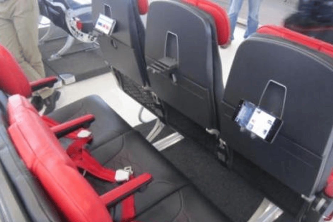 New, slim seats with device friendly features may be the next big thing at AirAsia. Photo: Boonsong Kositchotethana