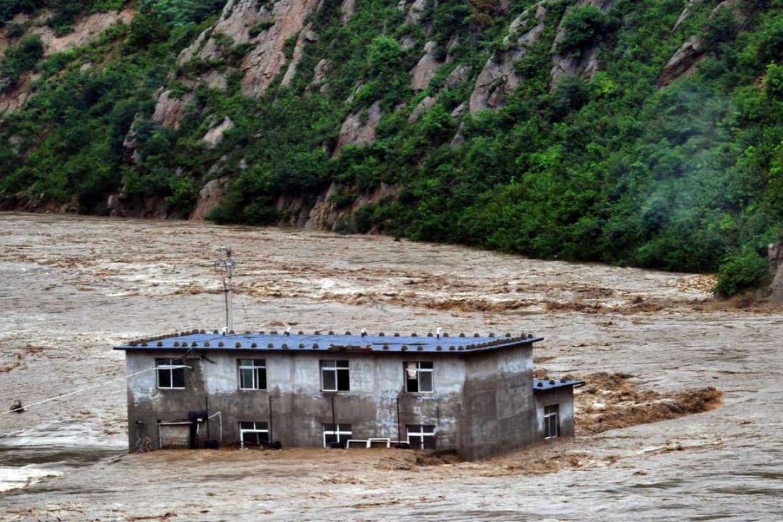 Buildings are inundated by floods in Benxi, Liaoning province, on August 4, 2012. Photo: Xinhua