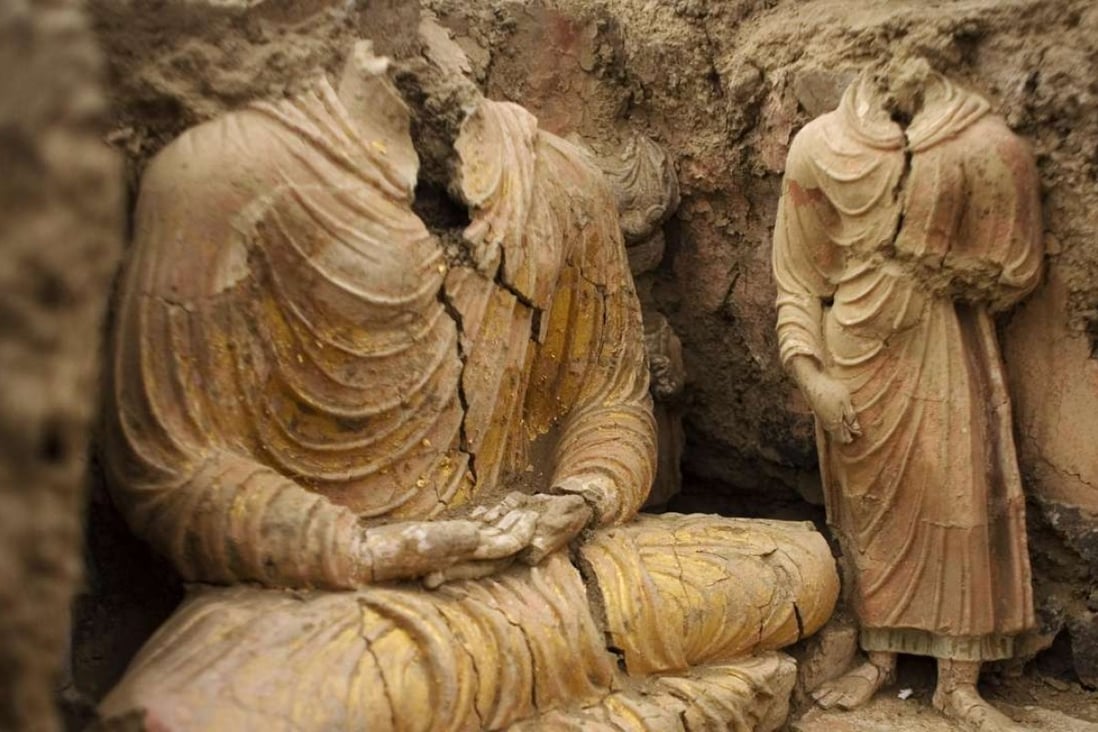 This 2010 photograph shows ancient Buddha statues inside a temple in Mes Aynak, Afghanistan, where a Chinese consortium has the rights to mine for copper. Photo: AP