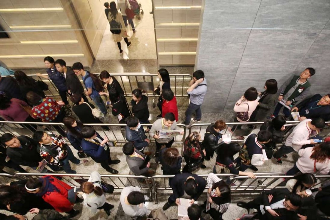 Long queue at the sales office of SHKP’s Cullinan West apartments on March 18. Photo: Edward Wong