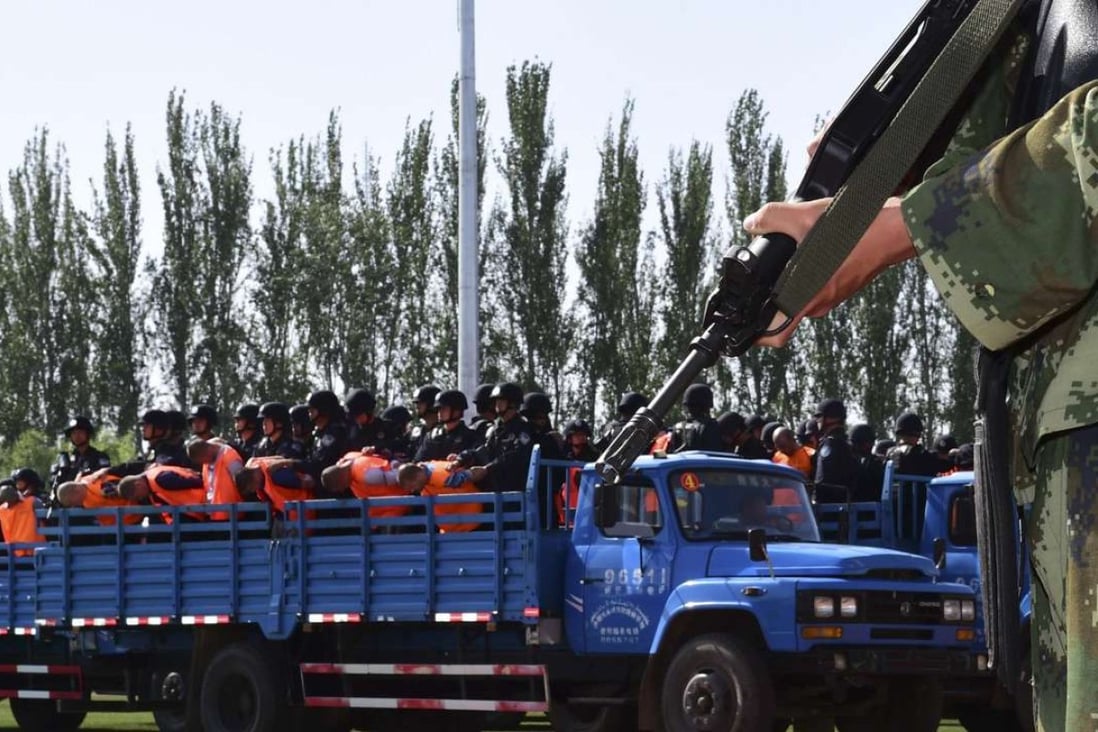 A truck carries criminals and suspects to a stadium for a mass sentencing rally in Yili, Xinjiang in this file photo from May 2014. Photo: Reuters