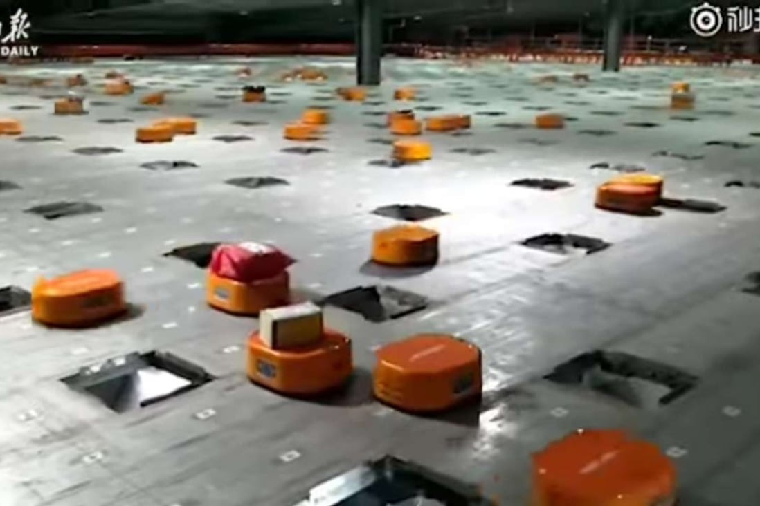 The army of little orange Hikvision robots in the sorting centre in STO Express’ delivery warehouse in Hangzhou, Zhejiang province. Photo: Handout