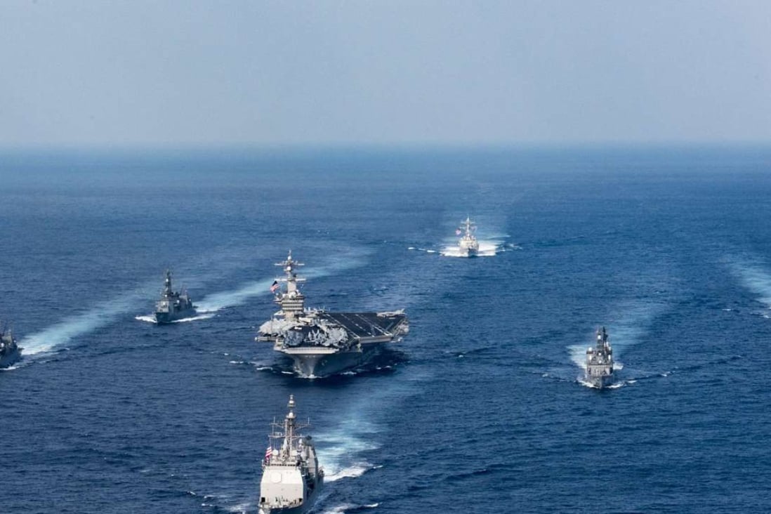 The US Navy aircraft carrier USS Carl Vinson, the guided-missile destroyer USS Wayne E. Meyer and the guided-missile cruiser USS Lake Champlain participate in an exercise with Japan Maritime Self-Defence Force destroyers in the Philippine Sea on March 28. File photo: EPA