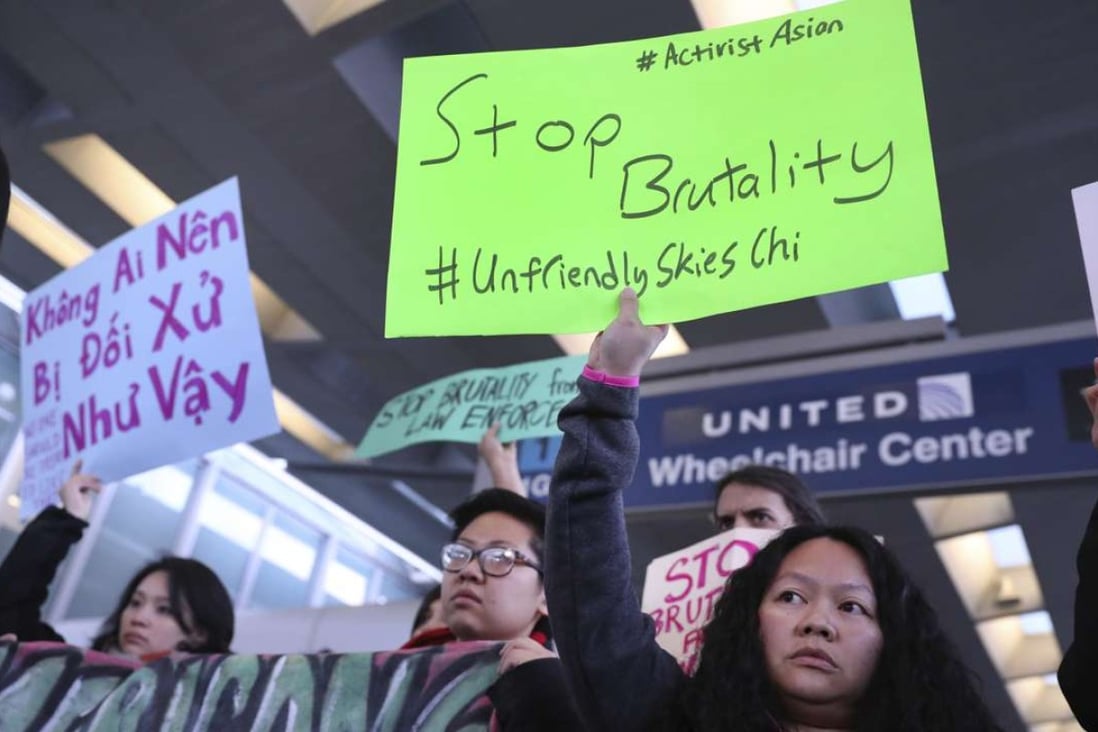 People from Asian community groups protest on Tuesday at Chicago’s O'Hare International Airport. Photo: AP