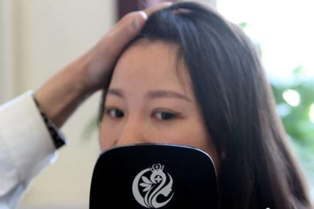 A young Chinese woman receives a consultation from a cosmetic surgeon. Photo: China News Service