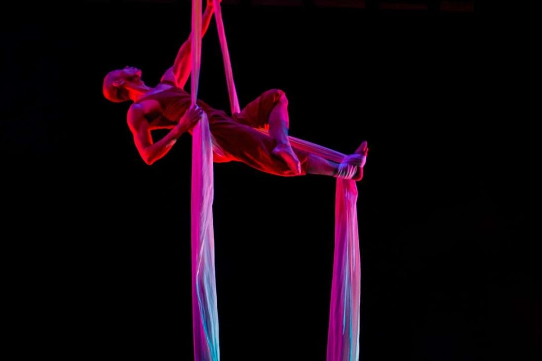 A scene from Melodia featuring aerialist Joe Lam.