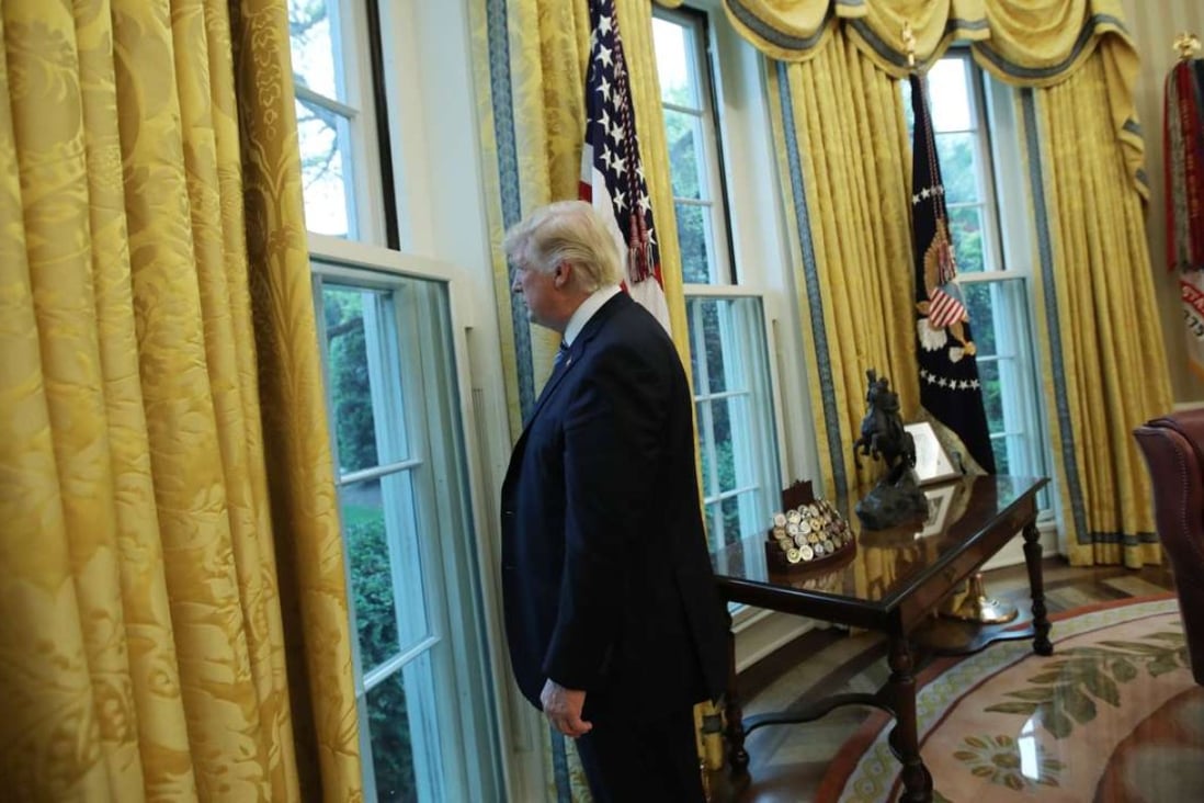 President Donald Trump looks out of a window in the Oval Office following a media interview this week. While the cupboard is mostly bare for Trump domestically, foreign policy has been more of a mixed bag for the “America first” president. Photo: Reuters