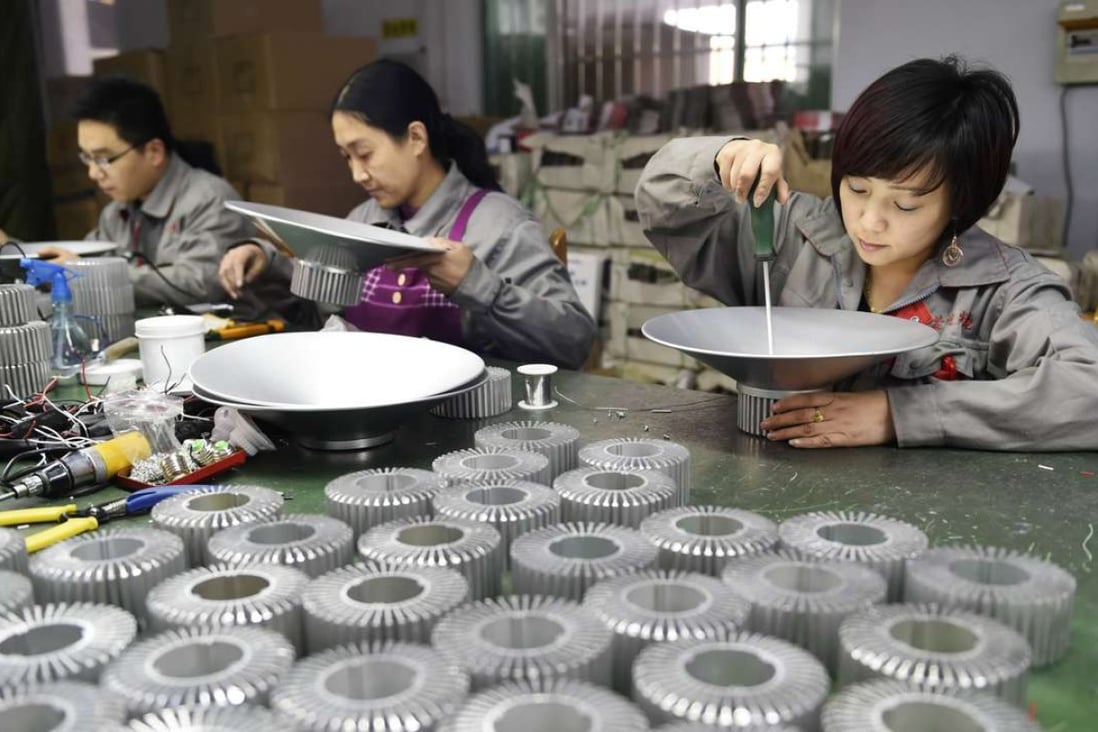 Workers assemble LED lights at a factory in Zouping, in eastern China's Shandong province. Photo: AFP