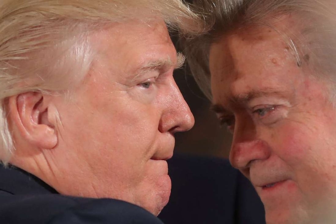 US President Donald Trump talks to Steve Bannon during a swearing-in ceremony for senior staff at the White House on January 22. Photo: Reuters