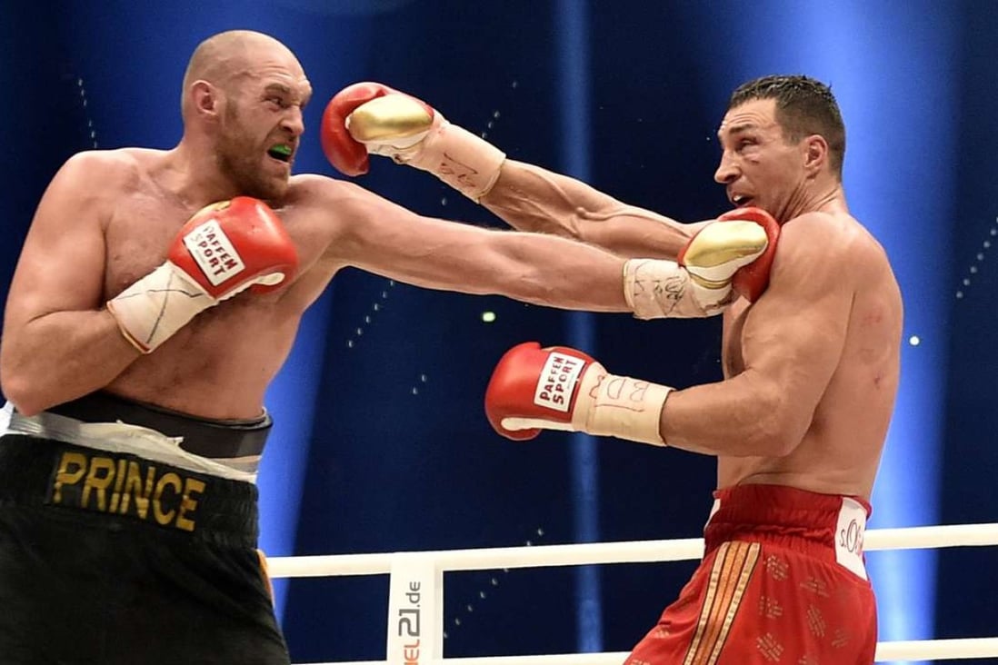Ukraine's Wladimir Klitschko, right, and Britain's Tyson Fury exchange blows during their bout in Duesseldorf in 2015. Photo: AP