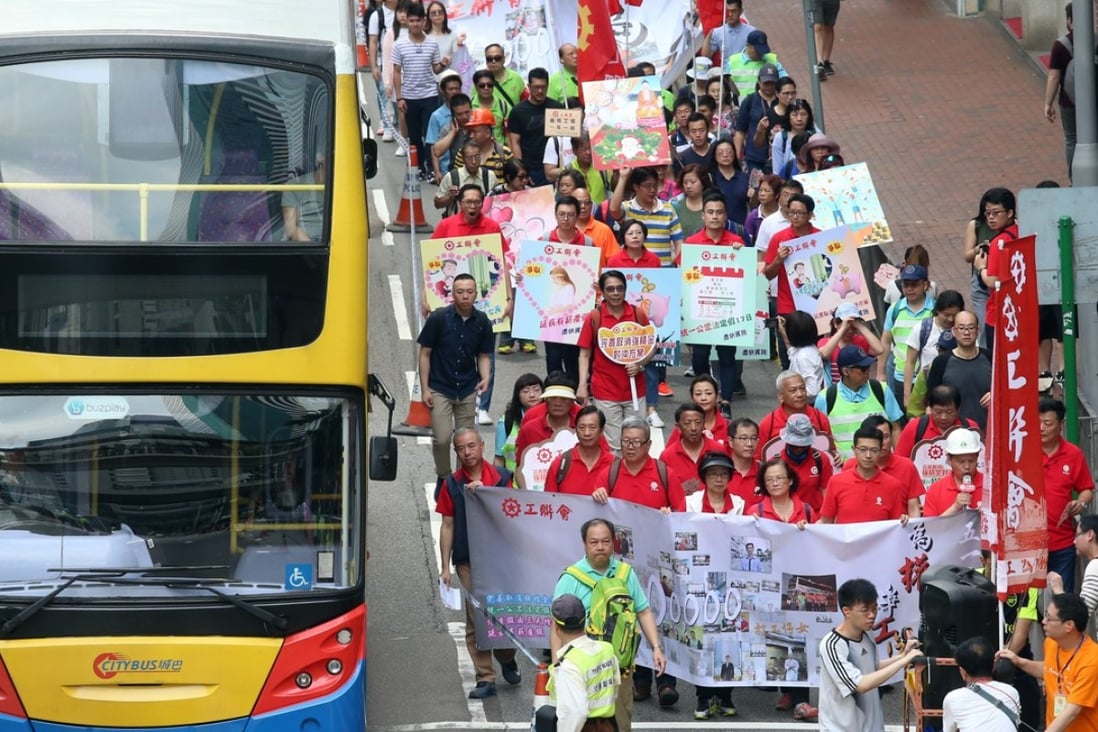 The march organised by the Federation of Trade Unions started at 10am in Wan Chai before proceeding towards government headquarters in Admiralty. Photo: K.Y. Cheng