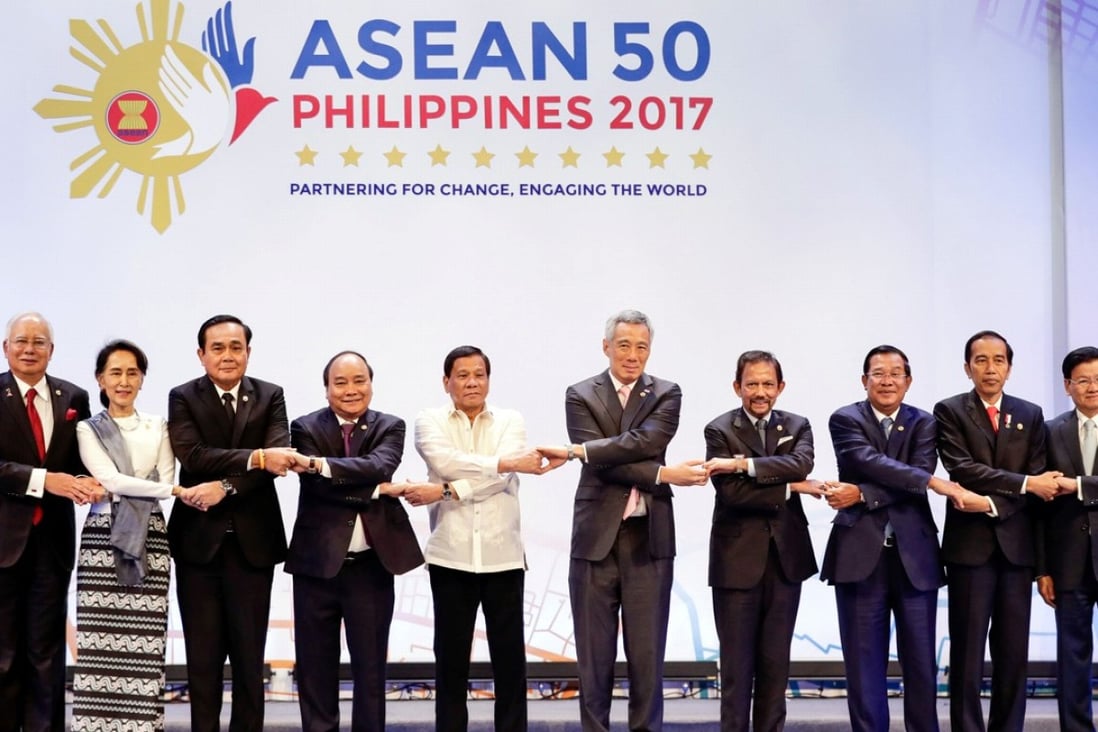 Asean leaders link arms during the opening ceremony of the 30th Asean Summit in Manila on Saturday. Photo: Reuters