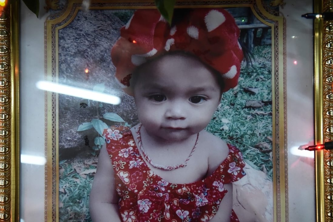 A memorial photograph of slain 11-month old girl Natalie is displayed at a temple in Phuket, Thailand, on April 27. She was murdered by her father who broadcast the killing on Facebook Live, before he killed himself. Photo: AFP
