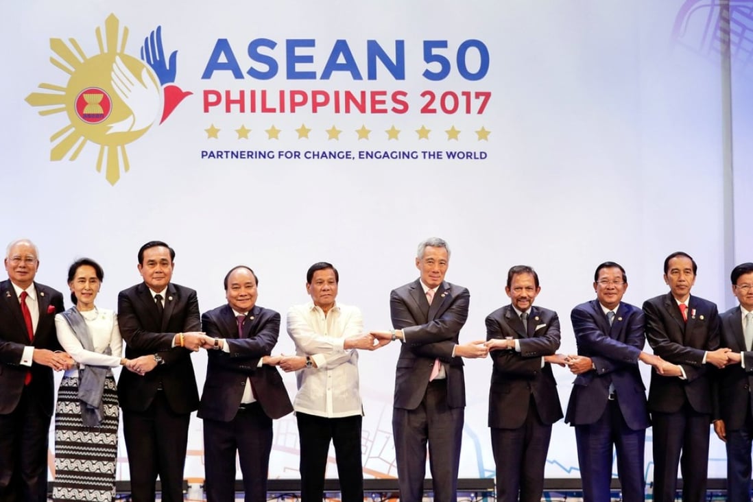 Leaders of Asean countries link arms during the opening ceremony of the 30th Asean Summit in Manila. Photo: Reuters