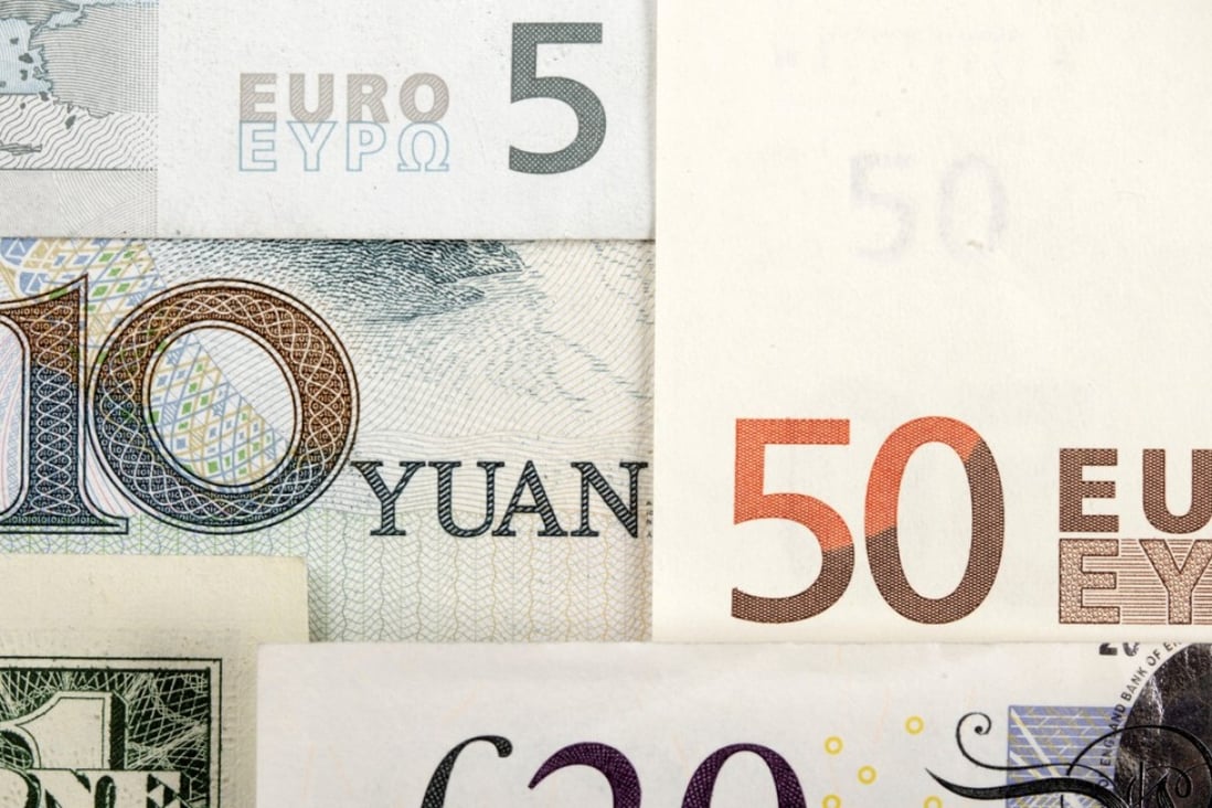 Arrangement of various world currencies including the Chinese yuan, US dollar, the euro, and British ound. Photo: Reuters
