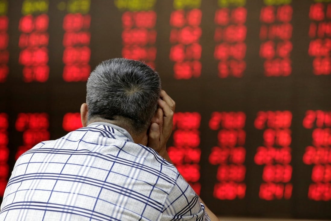 An investor looks at an electronic board showing stock information at a brokerage house in Beijing, China, in file photo from June 24, 2016. Photo: Reuters