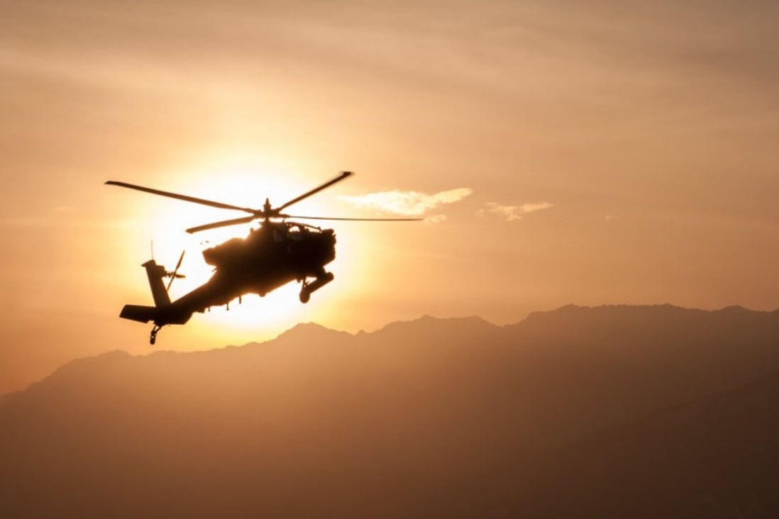 An Army Apache helicopter flies over Afghanistan. US President Donald Trump’s most senior military and foreign policy advisers have proposed a major shift in strategy in Afghanistan that would effectively put the United States back on a war footing with the Taliban. Photo: US Army